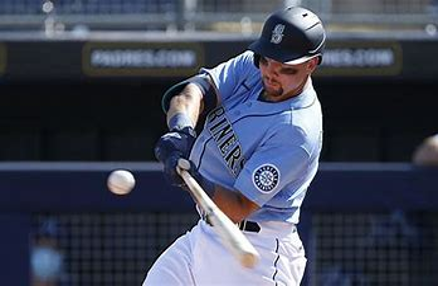 A Seattle Mariners player swinging at an oncoming ball